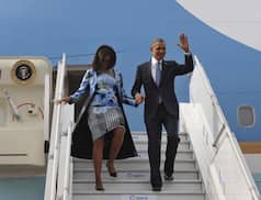 US President Barack Obama and first Lady Michelle Obama arrive in New Delhi
