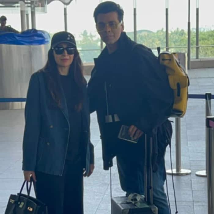 5Karisma Kapoor and Karan Johar Look Stylish for Their Airport Look