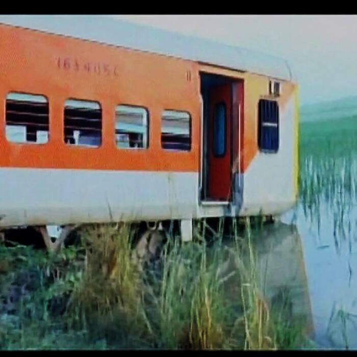 A coach of Kaifiyat express sunken in water near tracks
