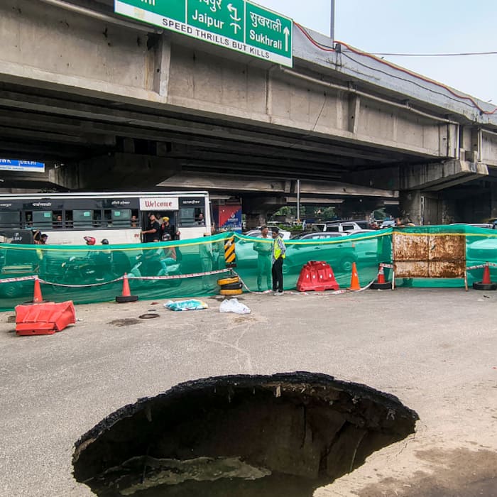 A road caves in at Gurugram IFFCO Chowk