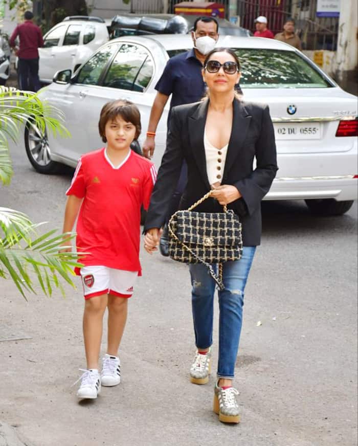 Abram Khan wore a red t-shirt with white shorts