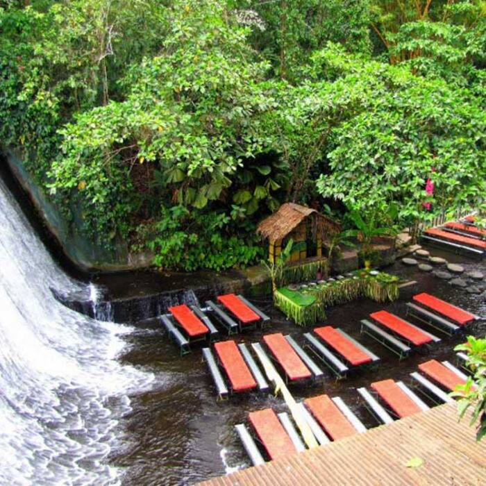 Bamboo tables at Labassin Waterfall Restaurant in Philippines