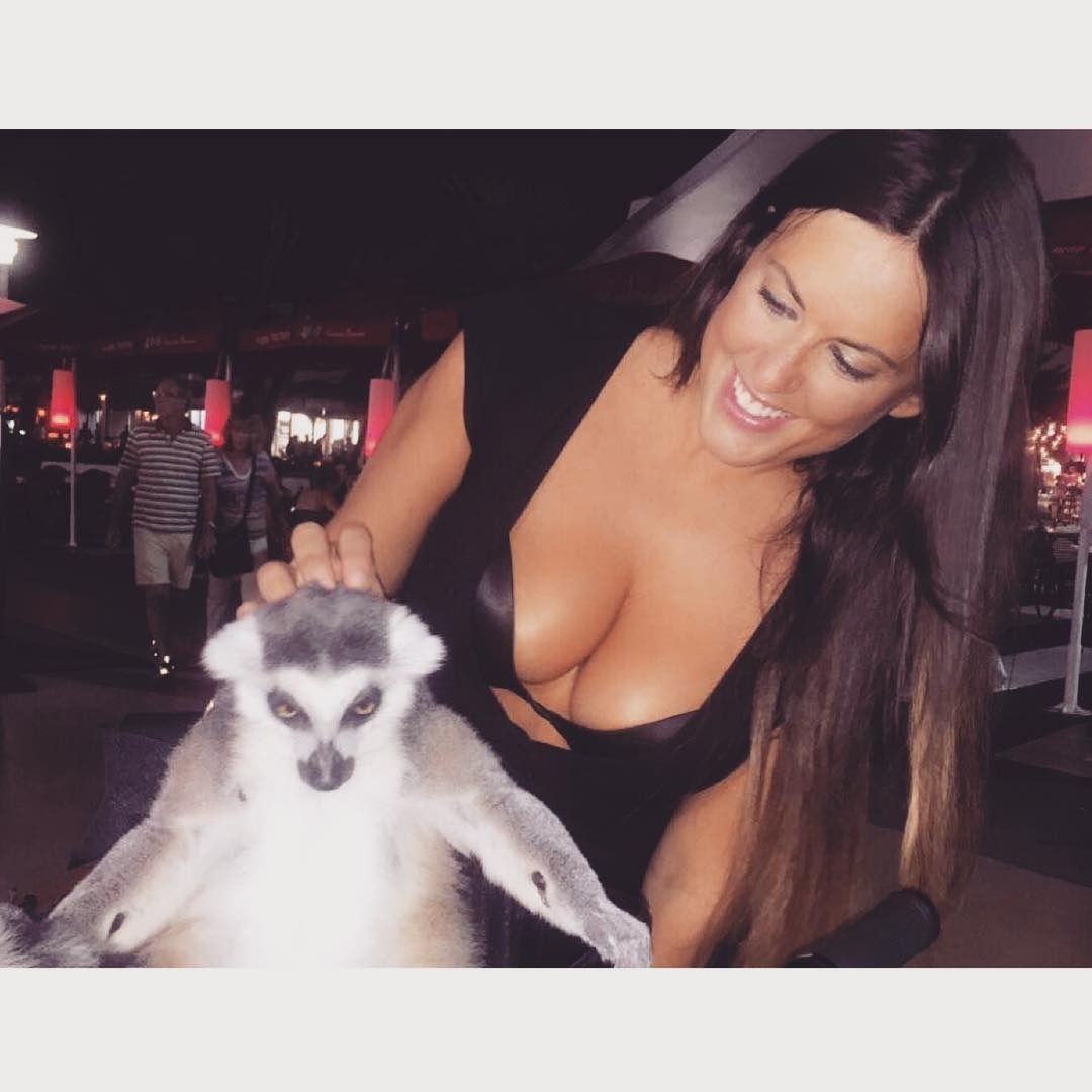 Claudia Romani Cuddles The Pet