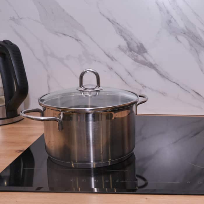 Cooking with lid on induction cooktop