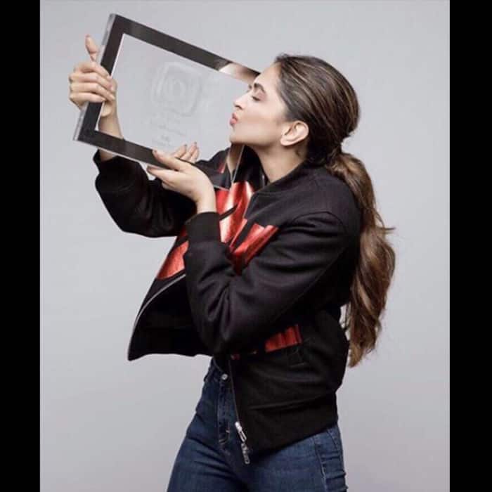 Deepika Padukone receives an award from Instagram