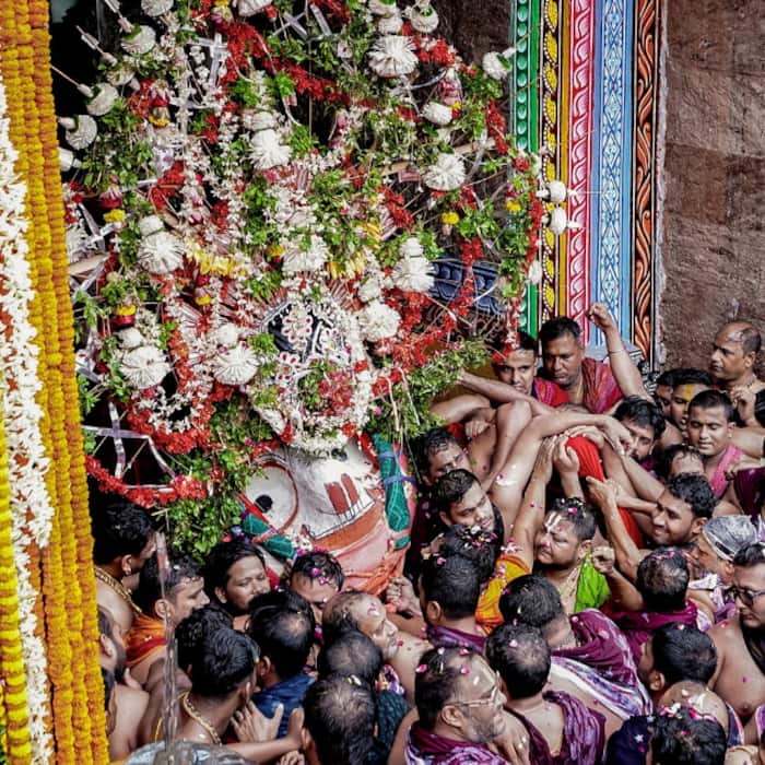 Devotees gathered to pull sacred wooden chariots during the Rath Yatra