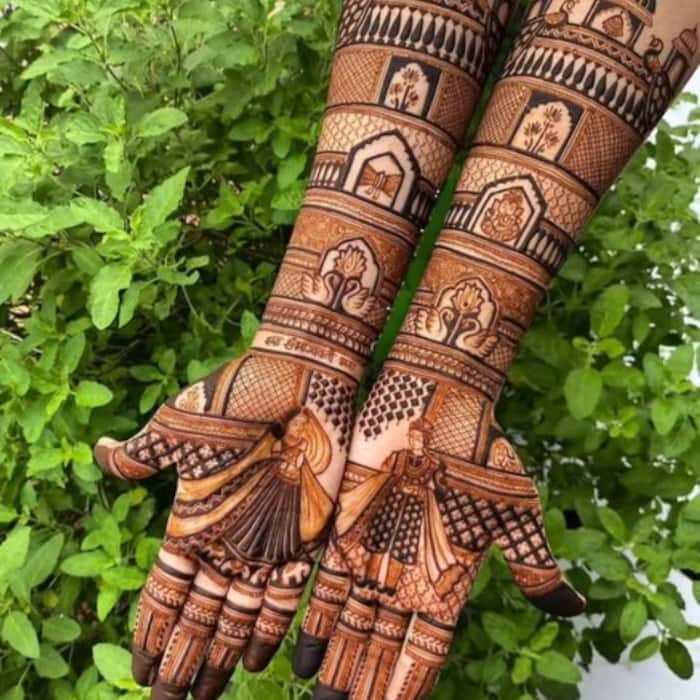 Dulha-Dulhan mehndi design: This mehndi design beautifully blends romance, tradition, and festive elegance.