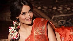 Elli AvrRam Stuns in Scorching Hot Photoshoot in Orange Saree l PHOTOS