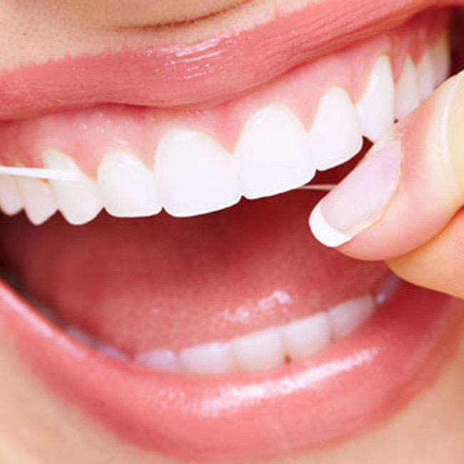Flossing teeth daily