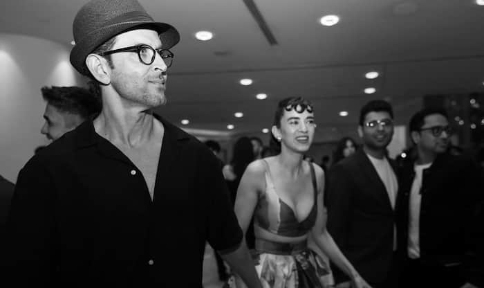 Hrithik Roshan cant stop looking at Saba Azad as they pose for the paparazzi