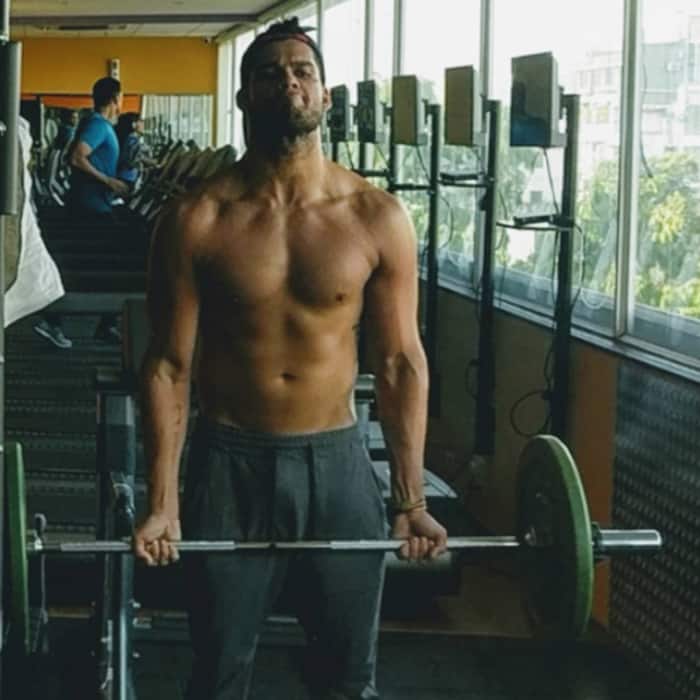 Karan Kapadia working out in gym