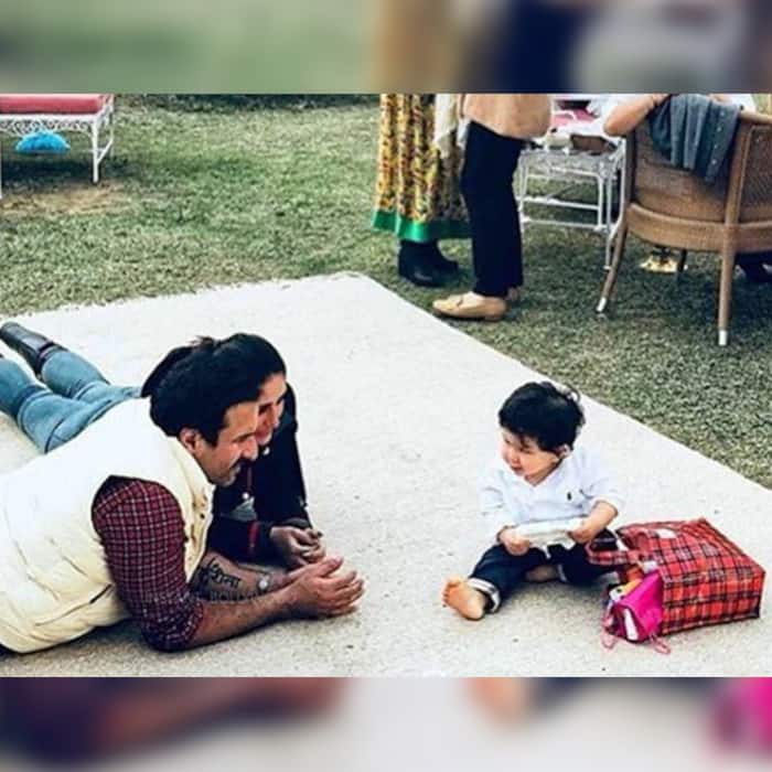 Kareena Kapoor Khan and Saif Ali Khan playing with Taimur