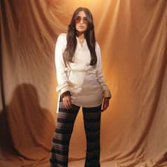 Karisma Kapoor Gives All the 'Dum Maro Dum' Retro Vibes in a Chic White Wrap-Around Shirt and Printed Pants