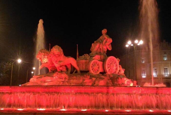 La Cibeles statue lit up red in Madrid  Spain