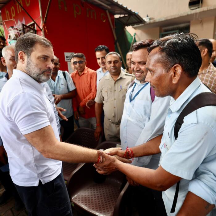 Leader of Opposition in Lok Sabha Rahul Gandhi exchanges a handshake with a DTC staff after taking a DTC bus ride at Sarojini Nagar Bus depot in New Delhi on Wednesday 