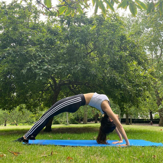 Learn some yoga postures from Mouni Roy