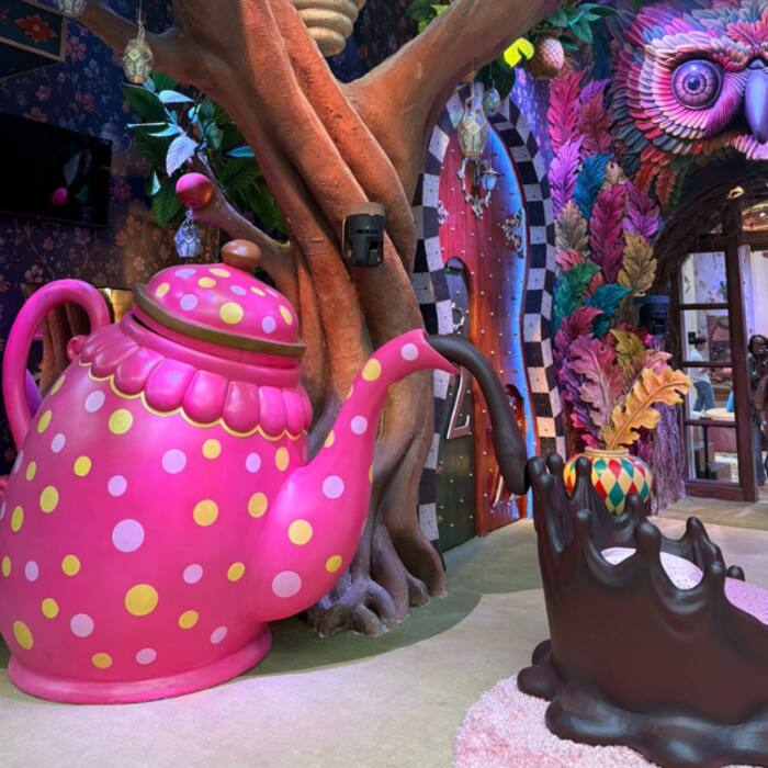 Living rooms teapot throne: Giant pink teapot throne adds a quirky touch.
