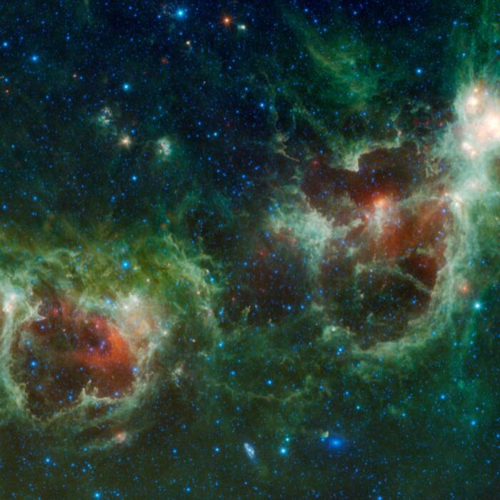 NASAs Wide-field Infrared Survey Explorer (WISE) mission captured this mosaic of the Heart and Soul nebulae