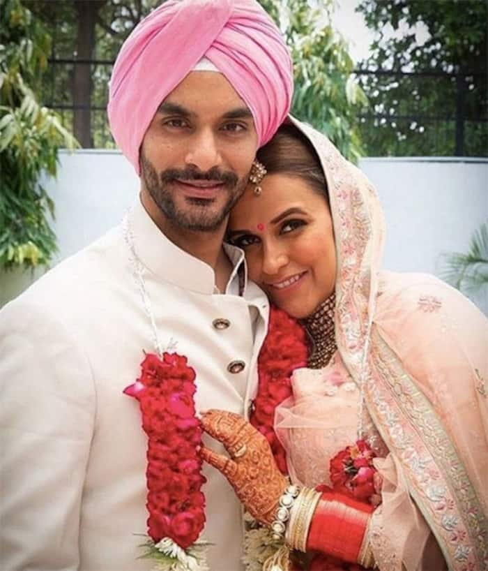 Neha Dhupia with husband Angad Bedi post wedding