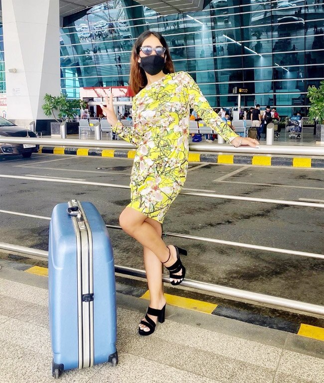 Neha Malik is seen flaunting her well-toned body in her neon dress