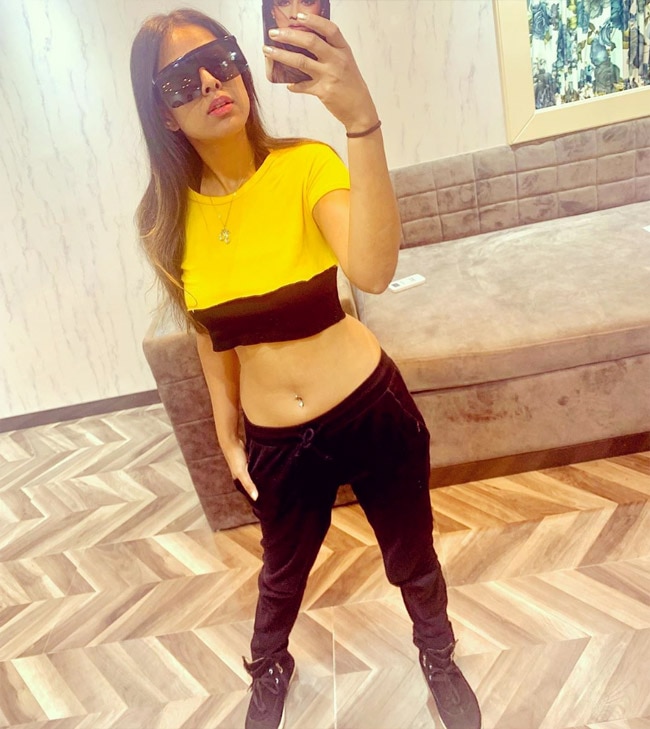 Nia rocks in yellow crop top