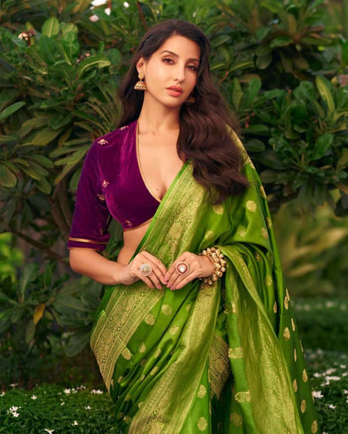 Nora Fatehi is a Beauty to Behold in Stunning Green Saree With Plunging