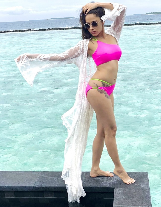 Nushrratt Bharuccha paired her pink bikini with a long white oversized shrug Nushrratt Bharuccha paired her pink bikini with a long white oversized shrug