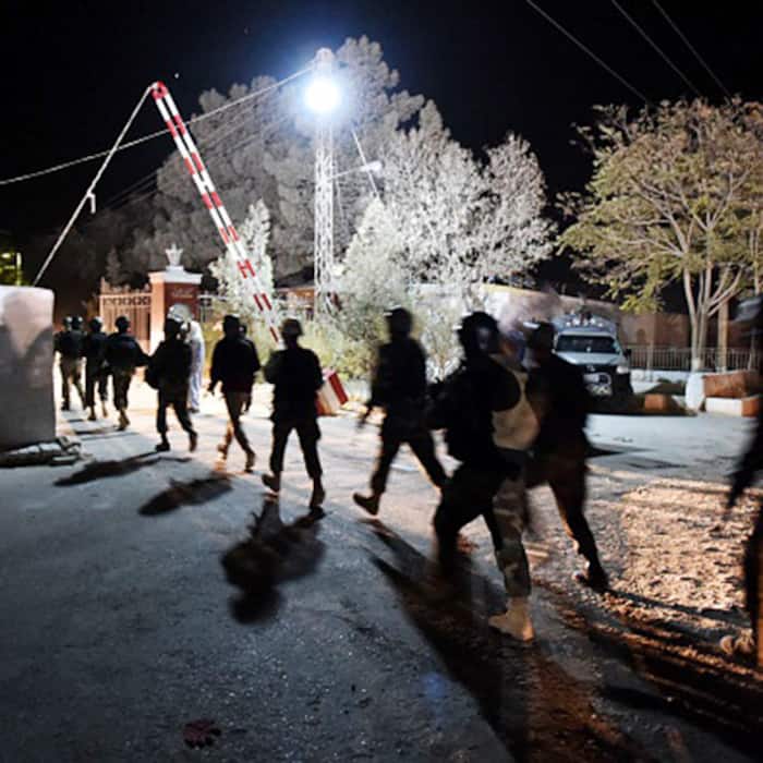 Pakistani army soldiers running into police training centre