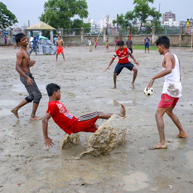 Play football on a rainy day to burn calories
