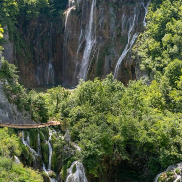 Plitvice Lakes National Park is celebrated for turquoise lakes and waterfalls.