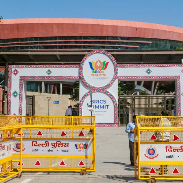 Police personnel stand guard near Bharat Mandapam ahead of the BRICS India Summit 2026