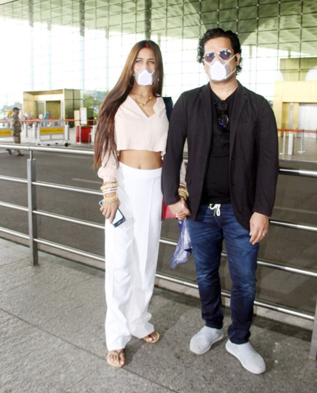 Poonam Pandey is seen holding her husband’s hand