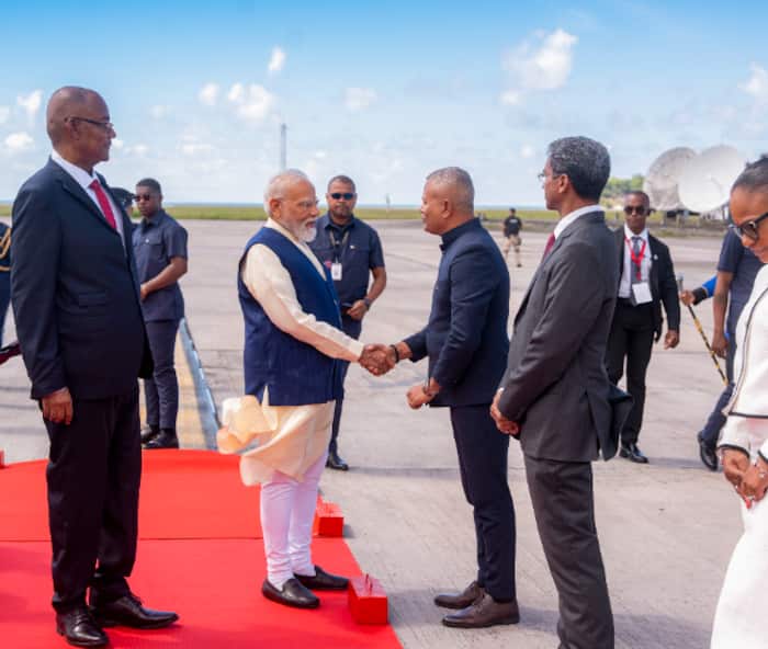 Prime Minister Narendra Modi is greeted by dignitaries