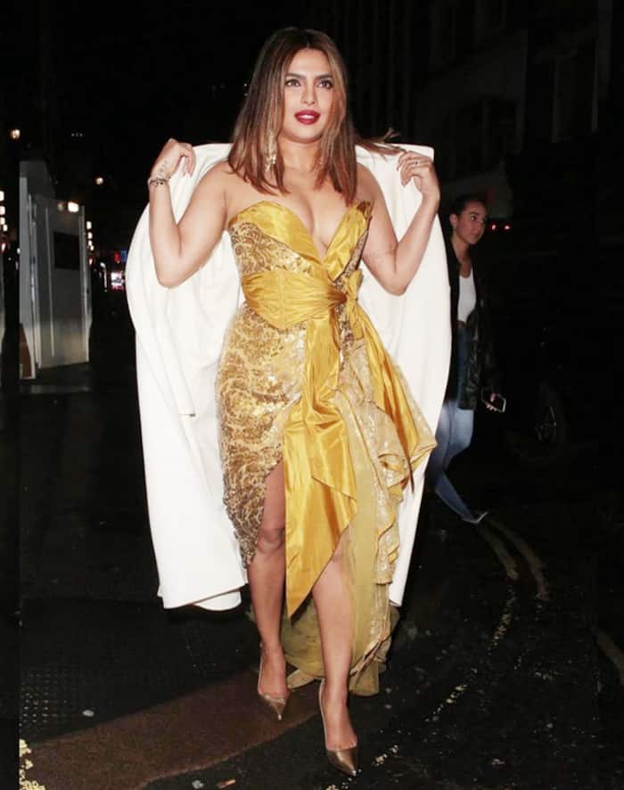 Priyanka Chopra shows off her caramel skin in a golden number by Vivienne Westwood