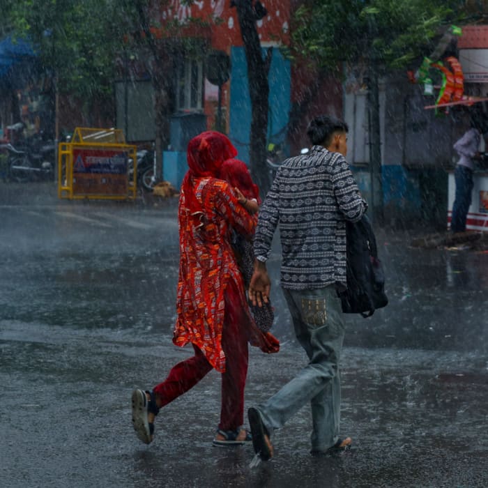 Rain lashes pink city