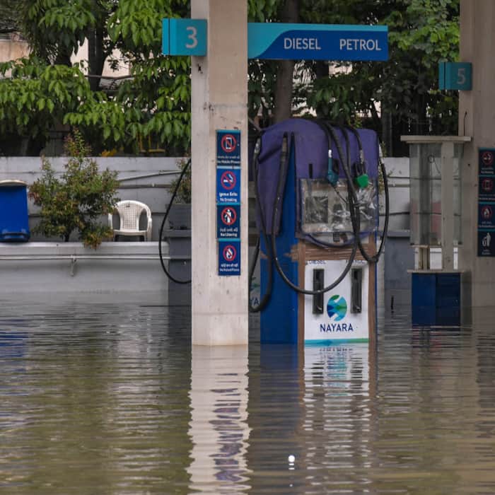 Rainwater accumulates at the premises of a petrol pump following heavy rainfall, in Surat, Gujarat