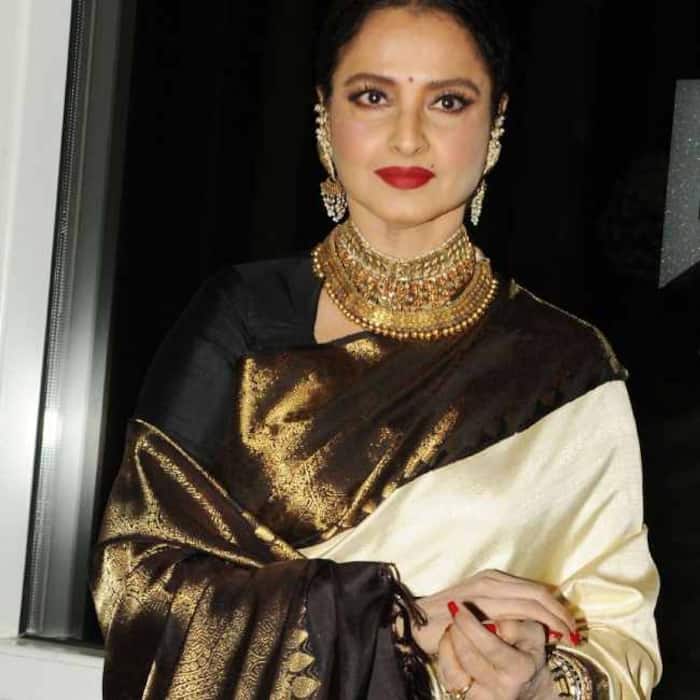 Rekha charms in classic black and white saree