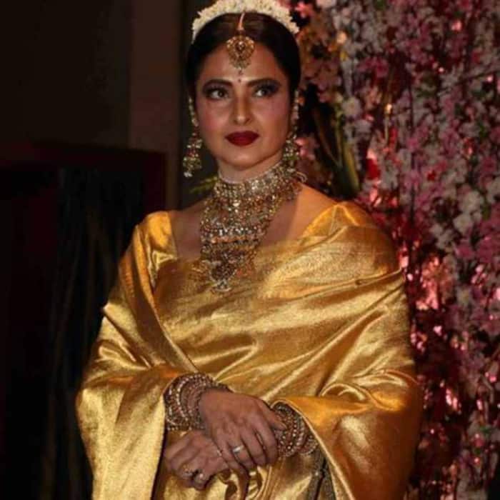 Rekha dazzles in regal golden saree look