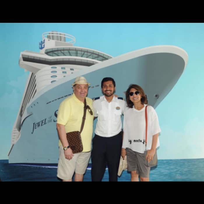 Rishi Kapoor and Neetu Kapoor posing with the captain of their cruise