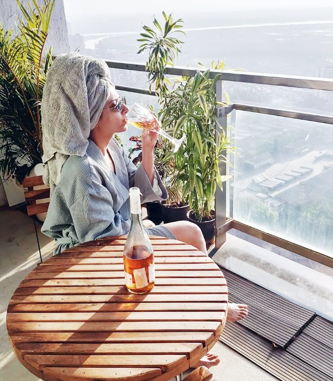 Punjabi Fame Sargun Mehta Sips Wine in Bathrobe as She Chills in Her