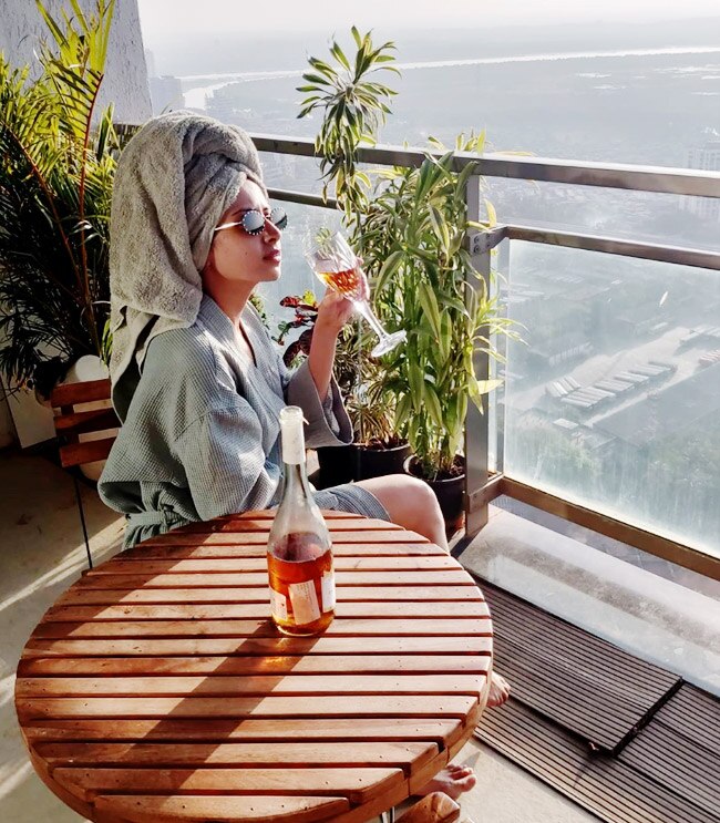 Punjabi Fame Sargun Mehta Sips Wine in Bathrobe as She Chills in Her