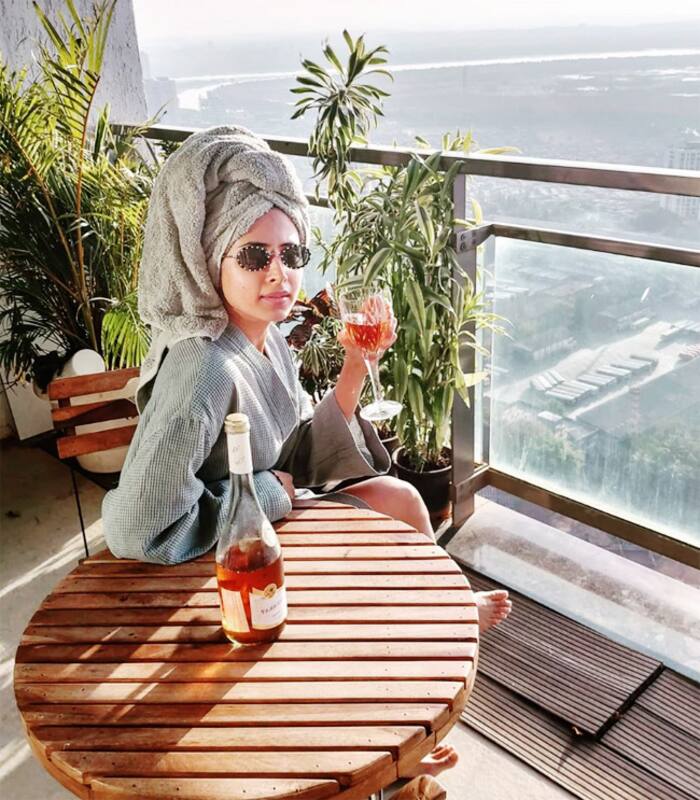 Punjabi Fame Sargun Mehta Sips Wine in Bathrobe as She Chills in Her