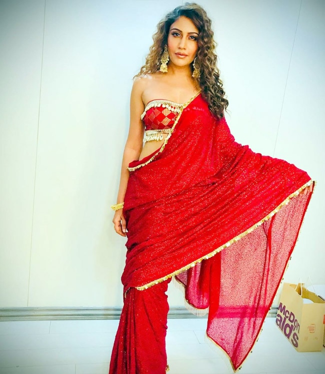 Surbhi Chandna Poses in a Sexy Red Saree