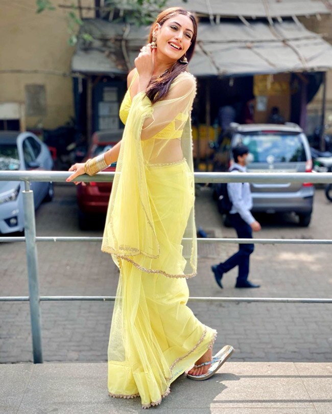 Surbhi Chandna sizzles in a sheer yellow saree with backless blouse