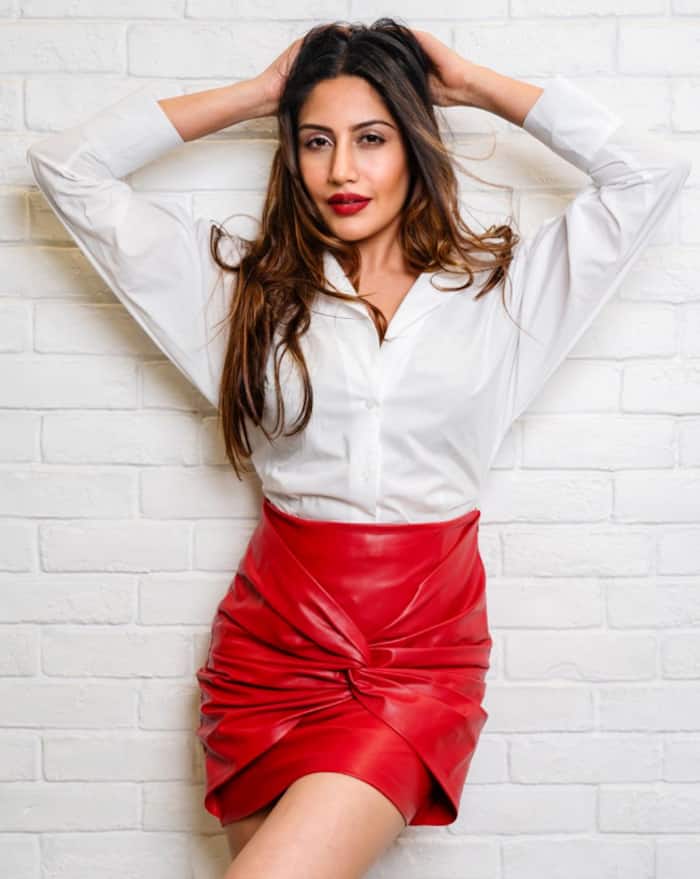 Surbhi Chandna wears a sexy red skirt with bold red lips