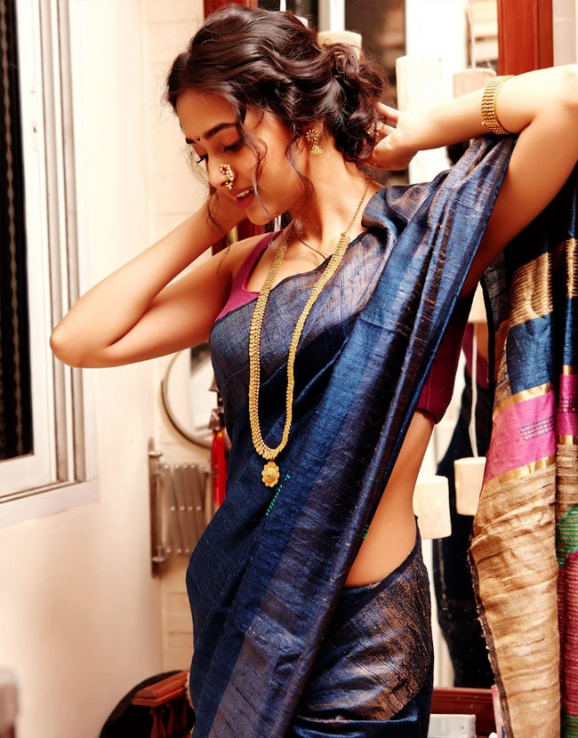 Tejasswi Prakash can be seen clad in a blue saree