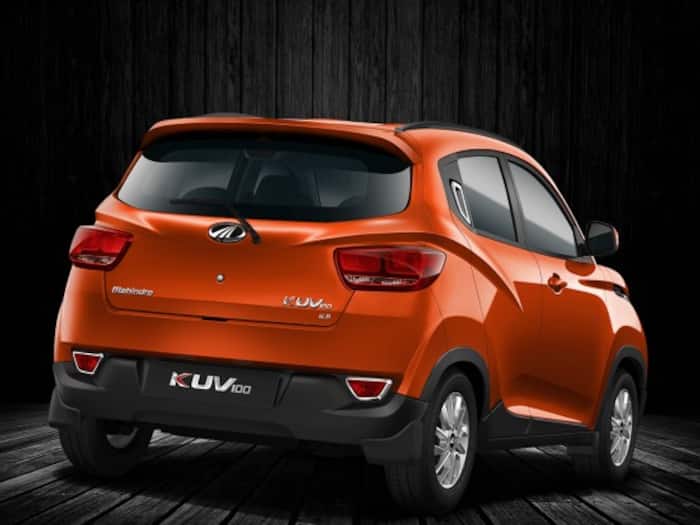 The newly launched Mahindra KUV100, a nex-gen SUV matches with the embryonic ambitions as well as lifestyle of today's youth. The rear profile of Mahindra KUV100 is rather very much simple and features large wraparound tail-lamps, chrome-accented rear fog lamps, stylish roof rails, black plastic cladding as well as rear wiper/washer. The new Mahindra KUV100 also gets sporty rear spoiler and dual-tone rear bumper with sporty mud-flaps.