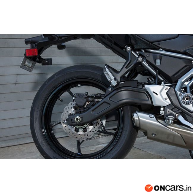 The suspension system comprises of telescopic forks up front and offset