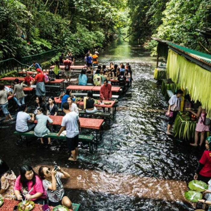 Tourists enjoying at Labassin Waterfall Restaurant in Philippines