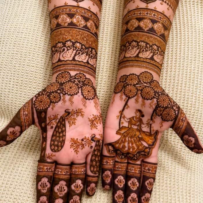 Traditional full-hand mehendi: A classic choice for a Teej festive look.